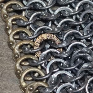 Close up of rings showing brass makers ring and details of wedge-shaped overlap