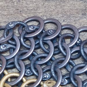 Alternating rows of riveted and solid rings